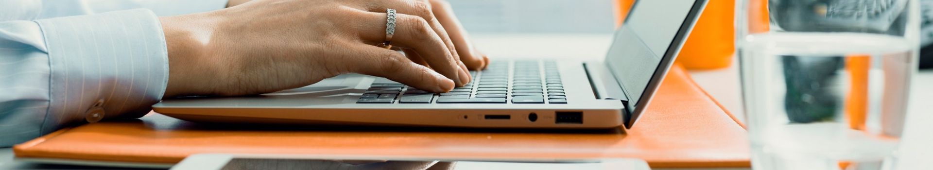 Fingers typing on keyboard