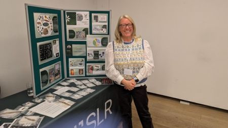 Ruth Beveridge showcasing Small finds on her SLR stall