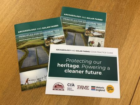The printed guide and pledge card reading 'Protecting out heritage, powering a cleaner future'. 
