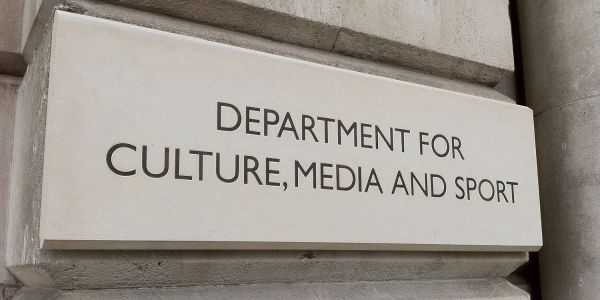 A sign on a stone wall reads 'Department for Culture, Media and Sport'.