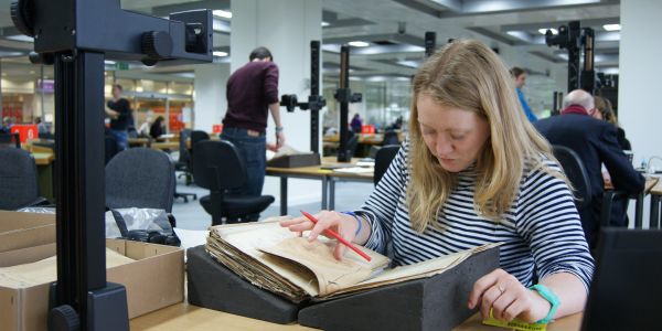 Women researching with book