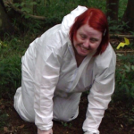 Photograph of Denise Hillier in white protective suit